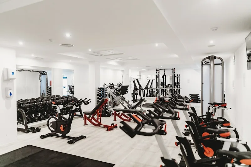 Spacious workout floor with modern equipment at Titan Fitness Club